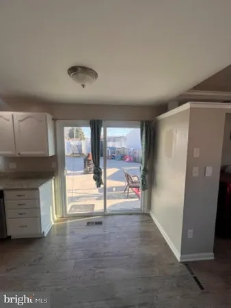 a view of an empty room with a fireplace