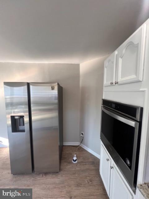 3703 Holly Grove Road Middle River, MD 21220 - Photo 31 of 40 a kitchen with metallic refrigerator and cabinets