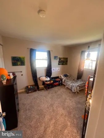 a room with furniture and a flat screen tv