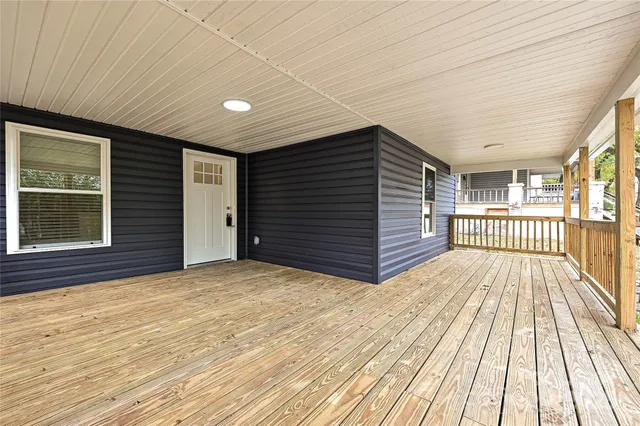a view of outdoor space with deck and hardwood