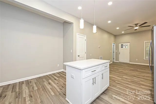 a bathroom with a sink a mirror and a shower