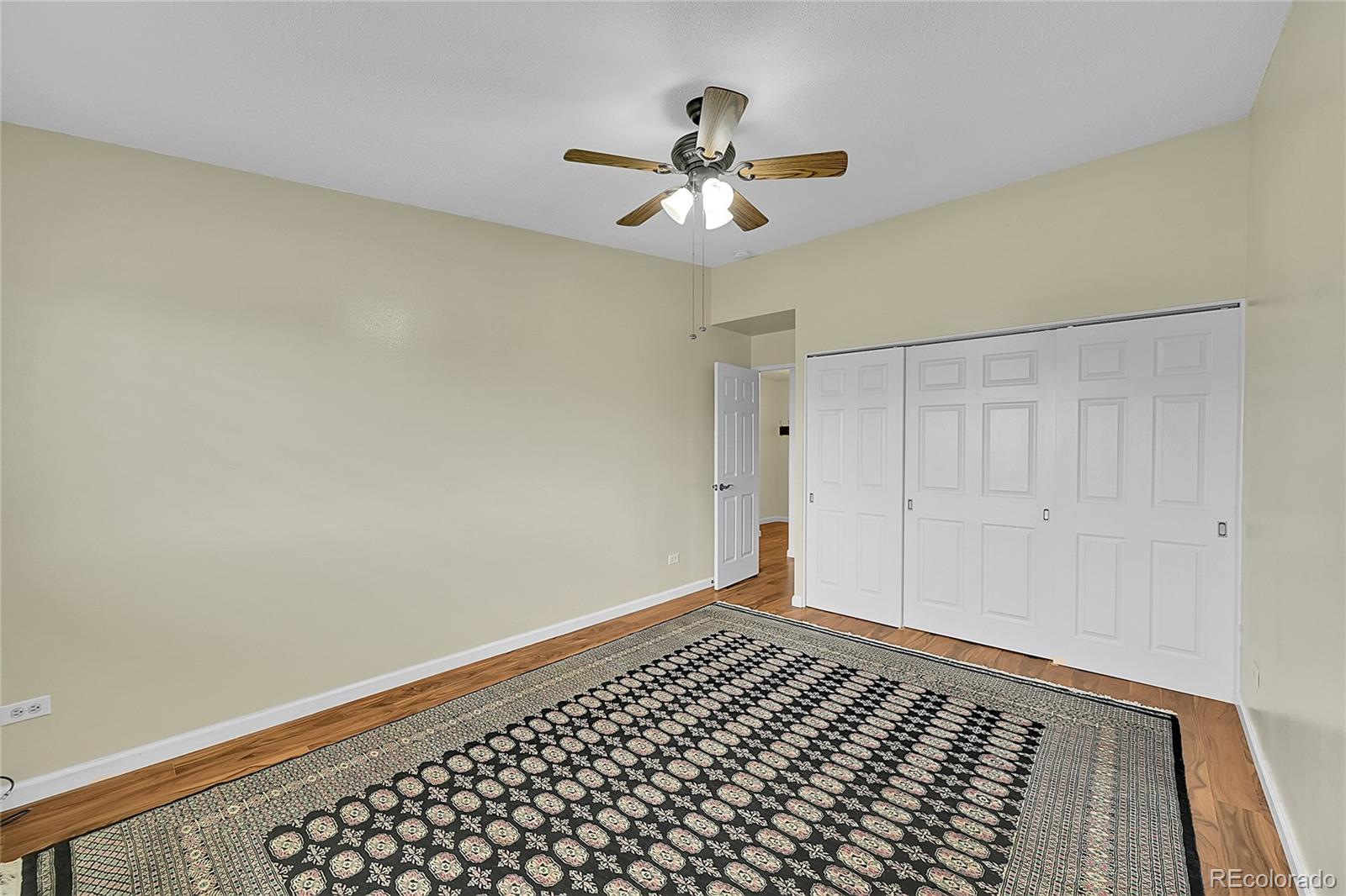 645 South Alton Way, Unit 9D Denver, CO 80247 - Photo 14 of 29 a view of a hallway with wooden floor