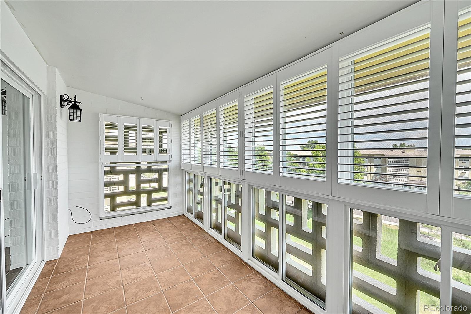 645 South Alton Way, Unit 9D Denver, CO 80247 - Photo 17 of 29 a view of a large room with windows