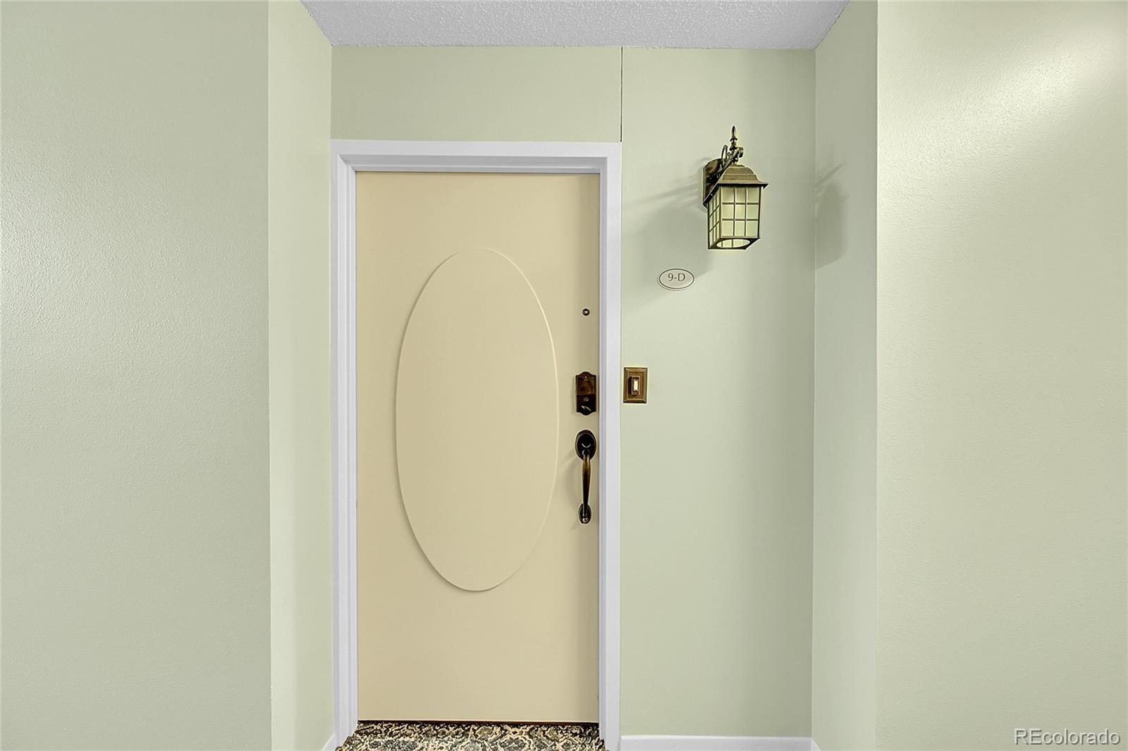 645 South Alton Way, Unit 9D Denver, CO 80247 - Photo 22 of 29 a bathroom with a glass shower door