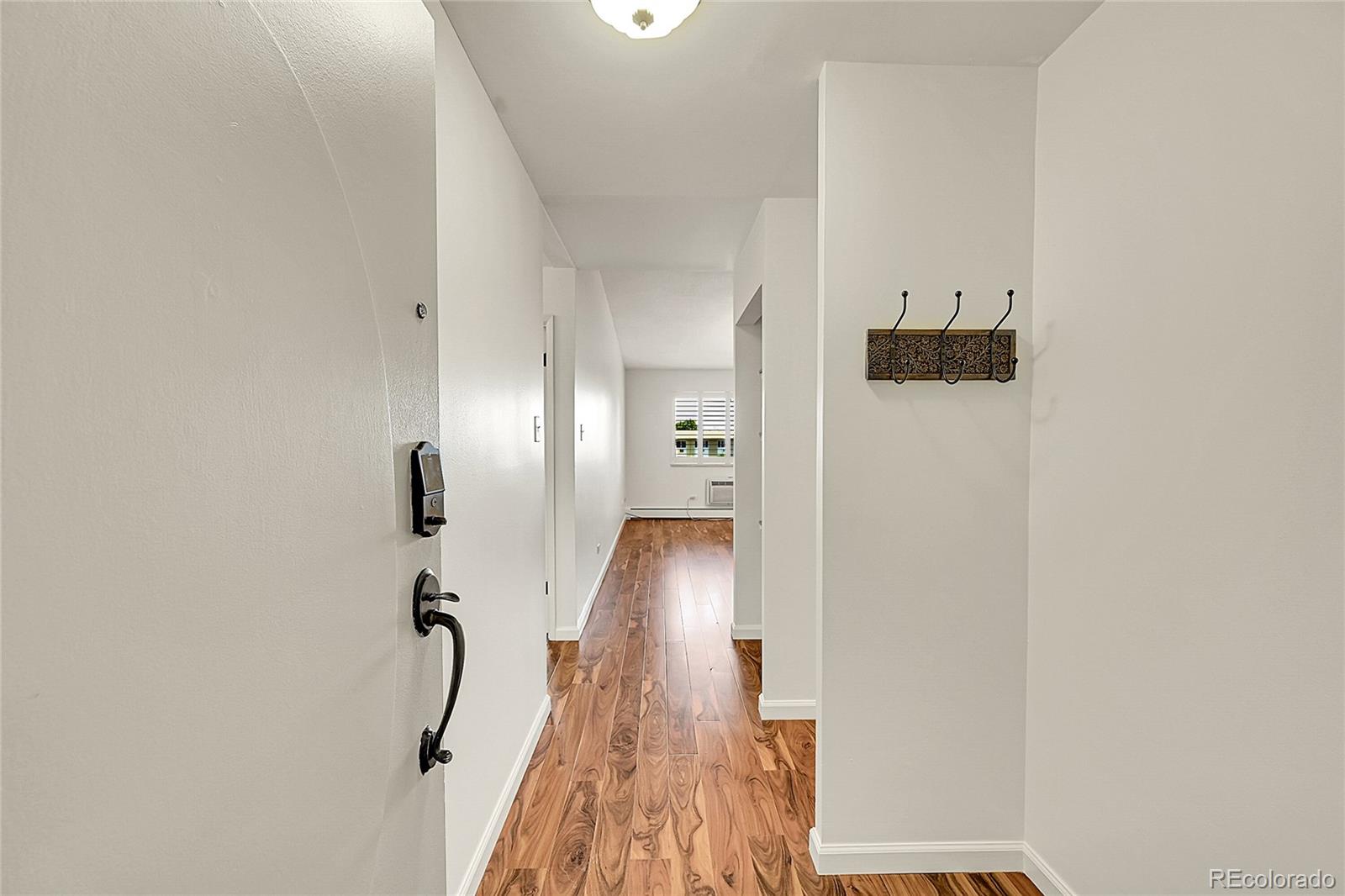 645 South Alton Way, Unit 9D Denver, CO 80247 - Photo 24 of 29 a view of hallway with furniture