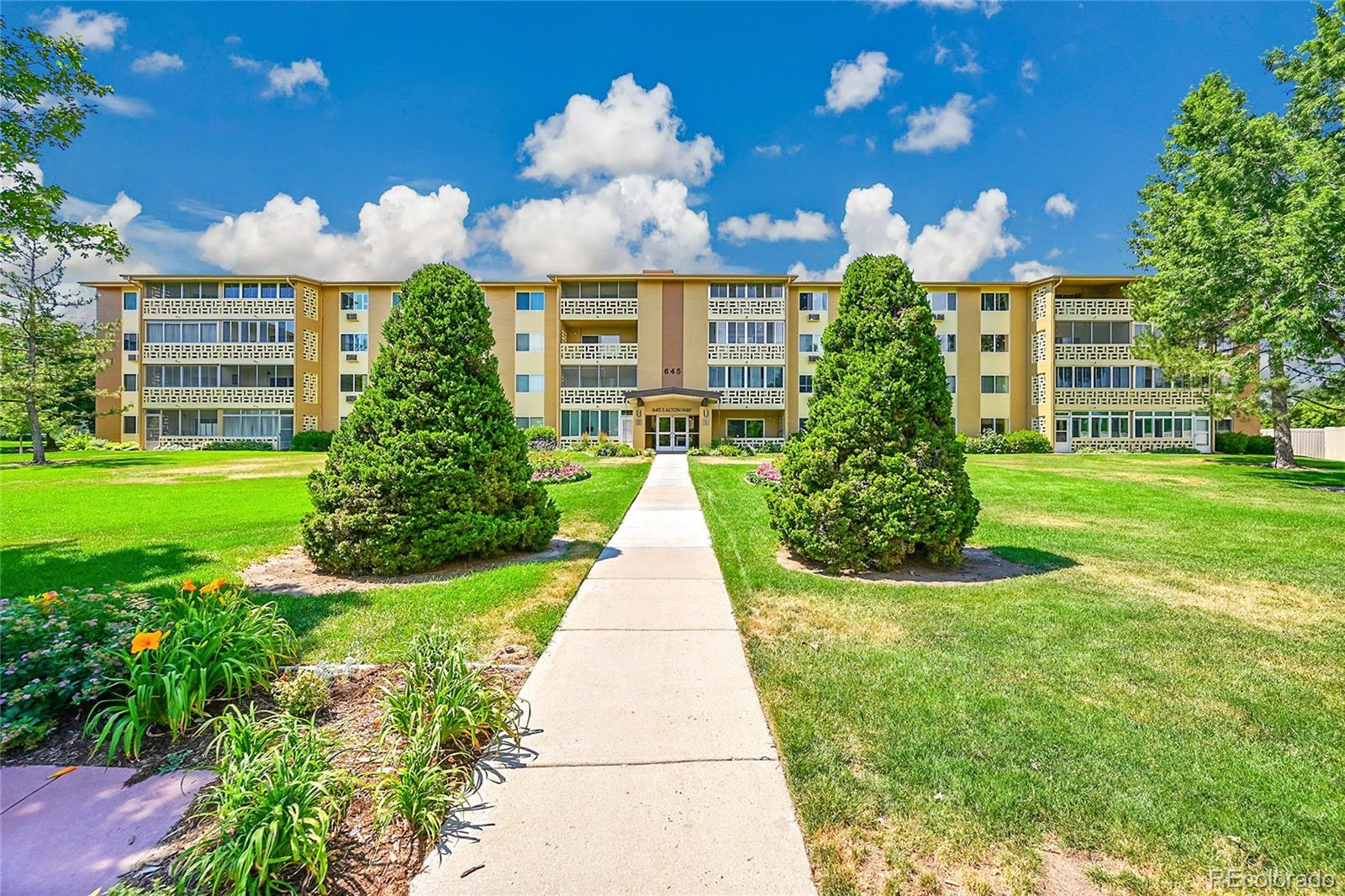 645 South Alton Way, Unit 9D Denver, CO 80247 - Photo 28 of 29 a view of a house with a yard