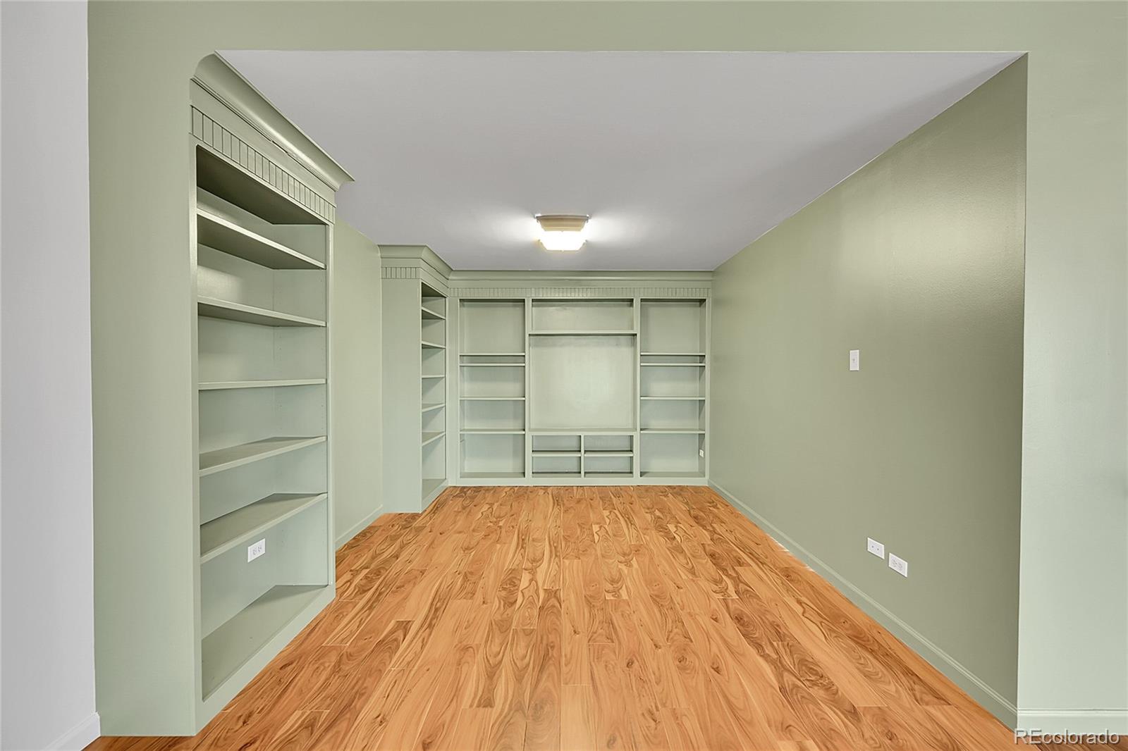 645 South Alton Way, Unit 9D Denver, CO 80247 - Photo 6 of 29 a view of empty room with wooden floor and window