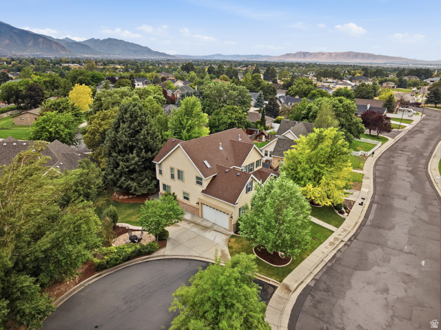 2388 East 850 South Springville, UT 84663 - Photo 55 of 58 Two-story residence with a two-car garage, mature landscaping, and a paved driveway