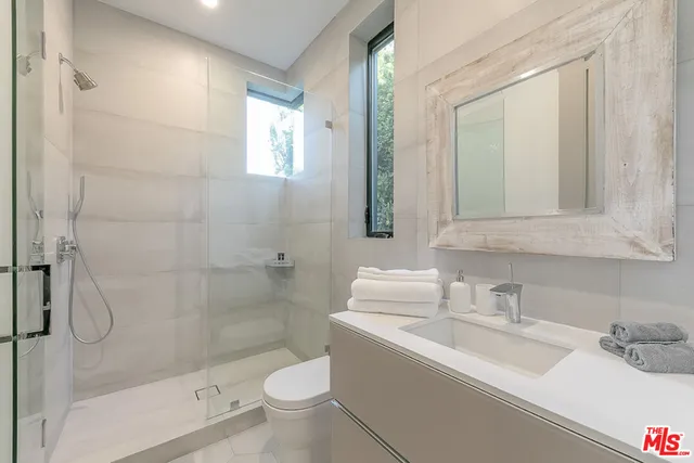 a balcony with furniture and a fireplace