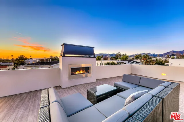 a view of a balcony with chairs