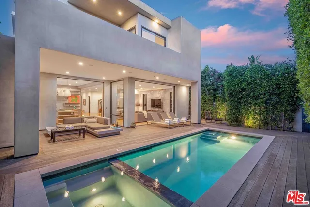 a view of a swimming pool with chairs