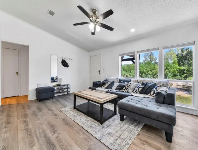 a living room with furniture and a large window