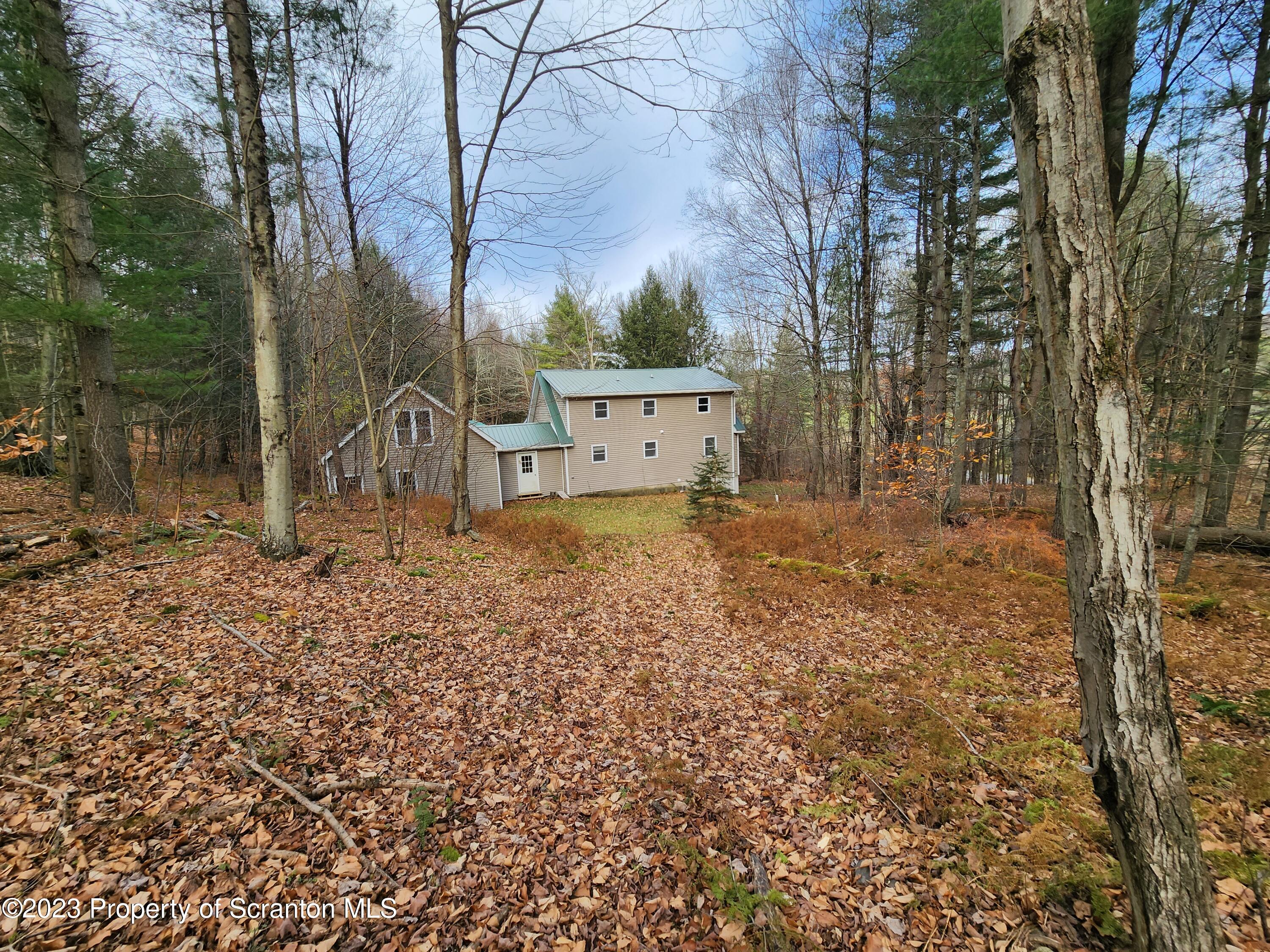 1575 State Rte 2009 Nicholson, PA 18446 - Photo 12 of 54 a backyard of a house with lots of green space