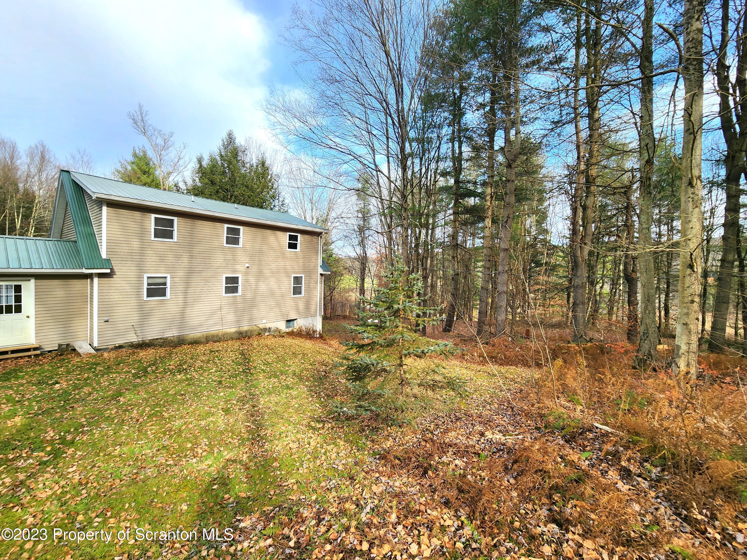1575 State Rte 2009 Nicholson, PA 18446 - Photo 14 of 54 a view of a house with a yard