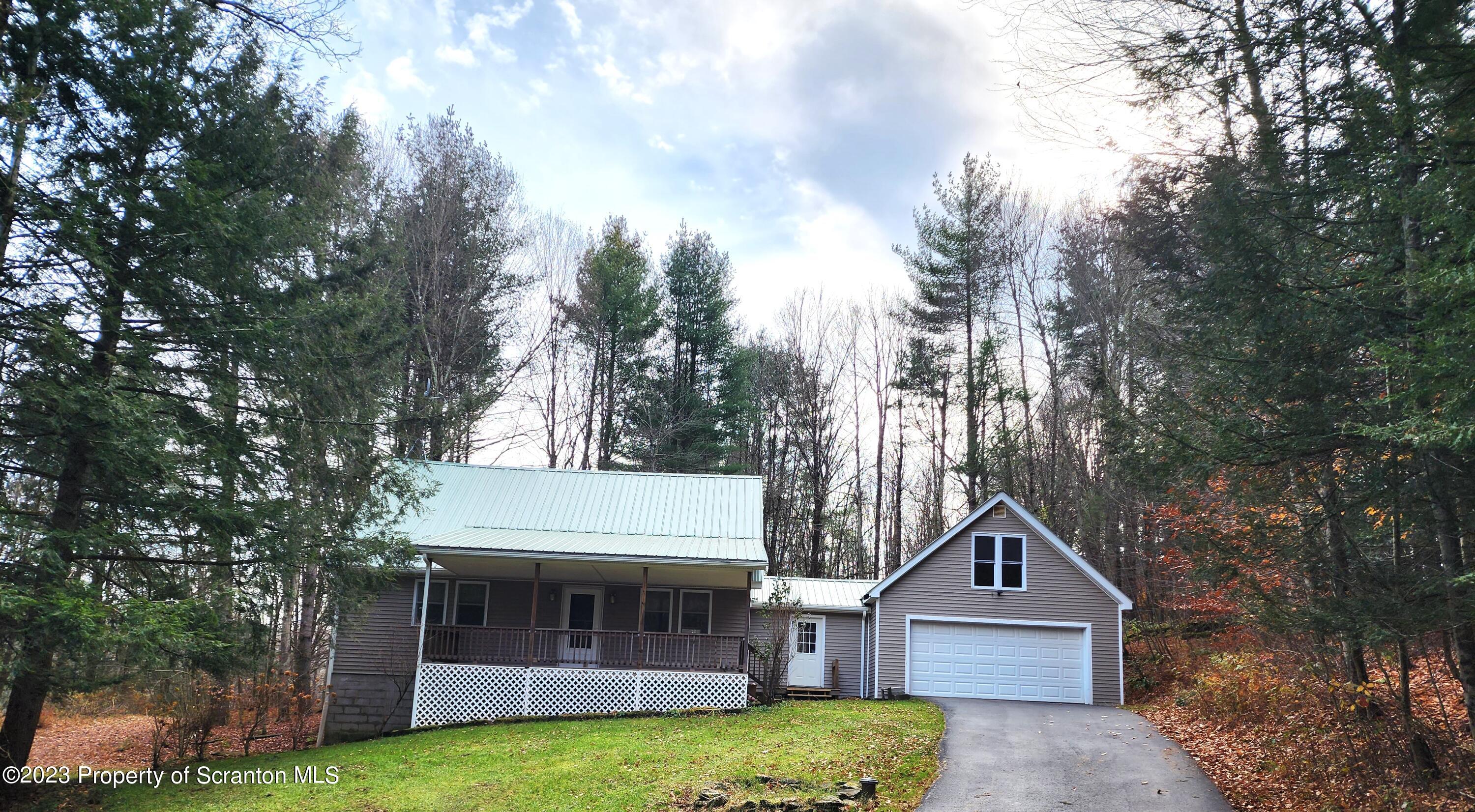 1575 State Rte 2009 Nicholson, PA 18446 - Photo 17 of 54 a front view of a house with garden