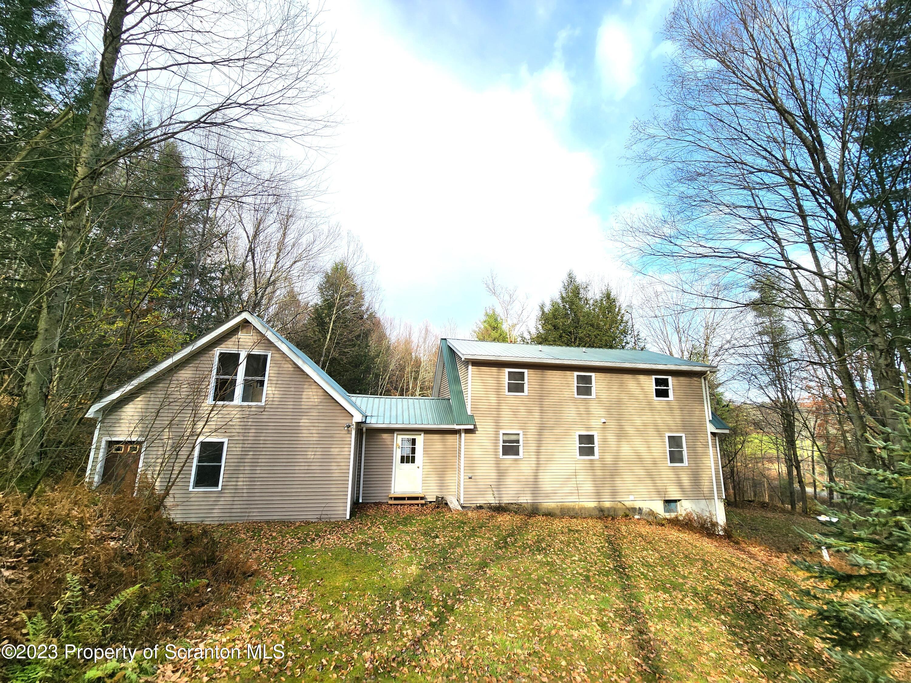 1575 State Rte 2009 Nicholson, PA 18446 - Photo 4 of 54 a view of a house with a yard