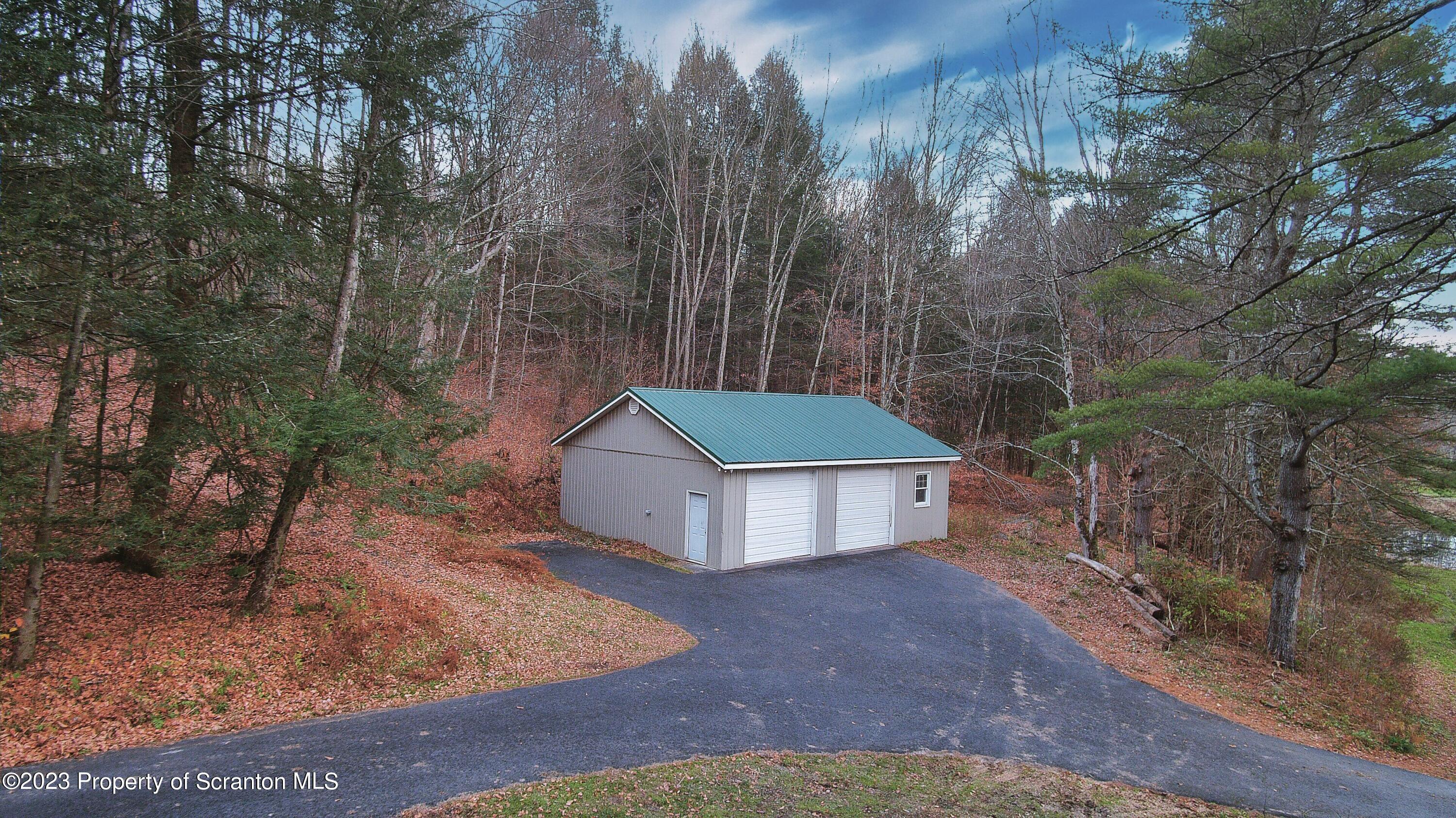 1575 State Rte 2009 Nicholson, PA 18446 - Photo 45 of 54 a white house with a yard and large trees