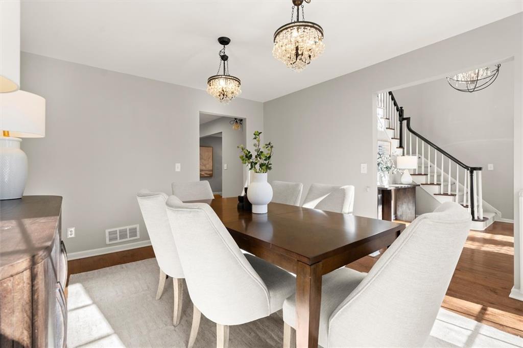 4367 Moss Ridge Court Northeast Roswell, GA 30075 - Photo 11 of 84 a view of a dining room with furniture and wooden floor