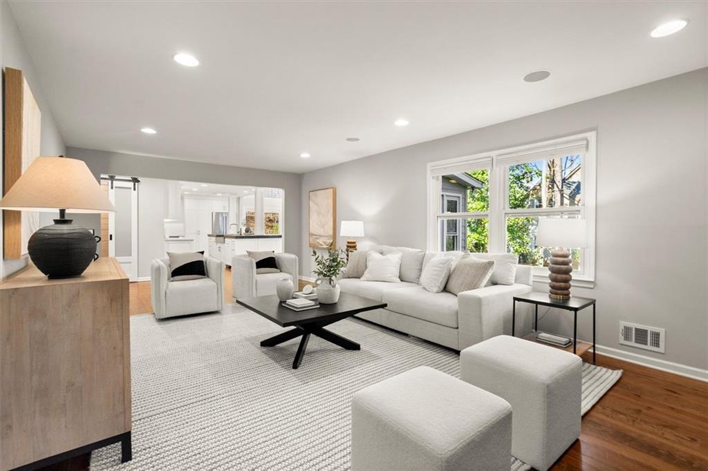 4367 Moss Ridge Court Northeast Roswell, GA 30075 - Photo 18 of 84 a living room with furniture and a large window