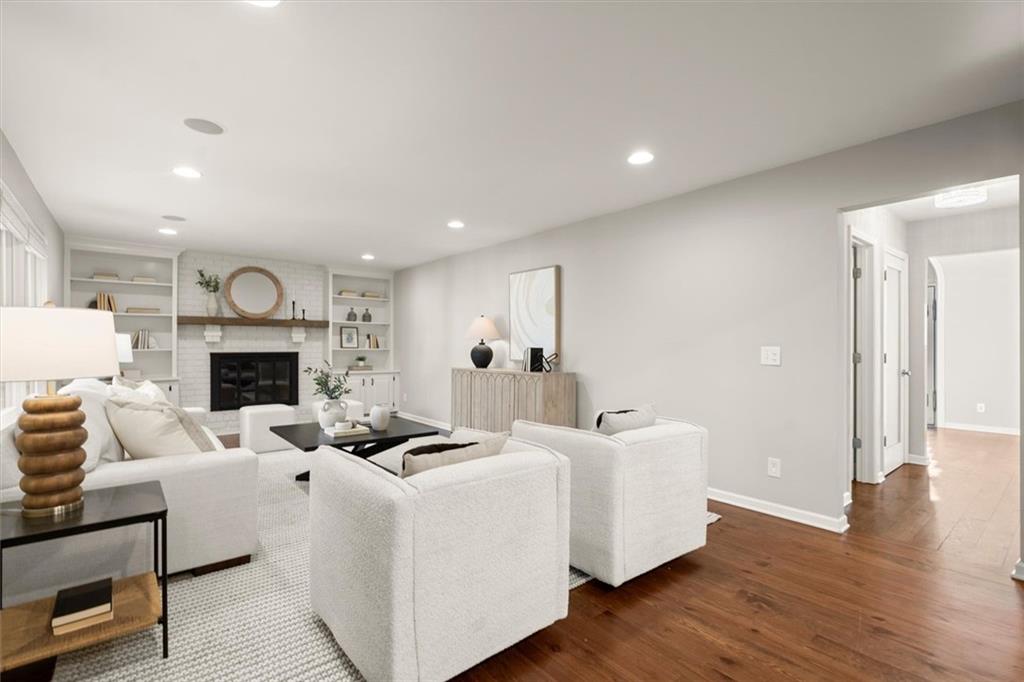 4367 Moss Ridge Court Northeast Roswell, GA 30075 - Photo 19 of 84 a living room with furniture a fireplace and wooden floor