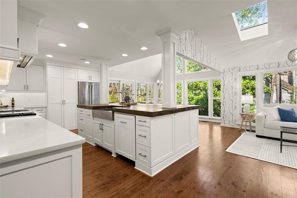 4367 Moss Ridge Court Northeast Roswell, GA 30075 - Photo 21 of 84 a kitchen with stainless steel appliances granite countertop a stove a sink and a refrigerator
