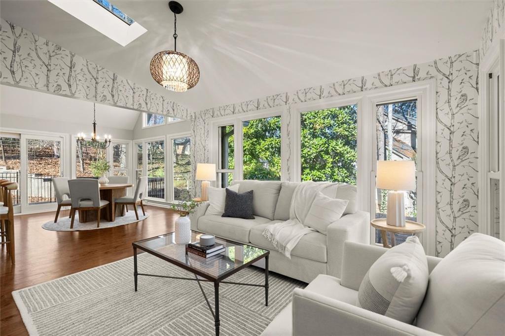 4367 Moss Ridge Court Northeast Roswell, GA 30075 - Photo 29 of 84 a living room with furniture and a large window