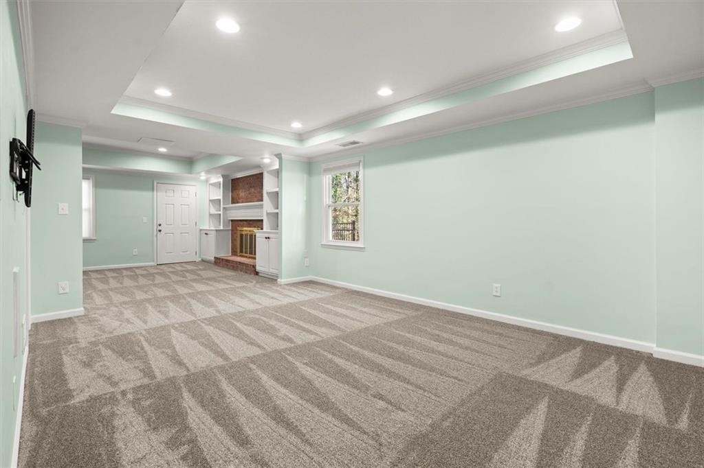 4367 Moss Ridge Court Northeast Roswell, GA 30075 - Photo 56 of 84 a view of empty room with a fireplace