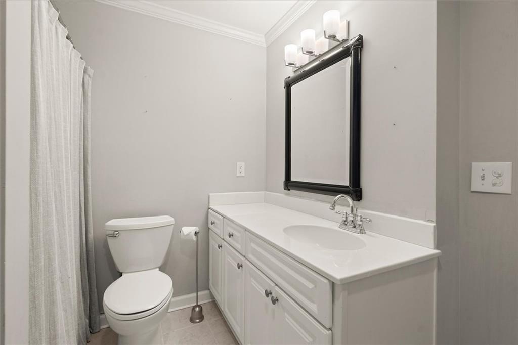 4367 Moss Ridge Court Northeast Roswell, GA 30075 - Photo 65 of 84 a bathroom with a sink toilet and mirror