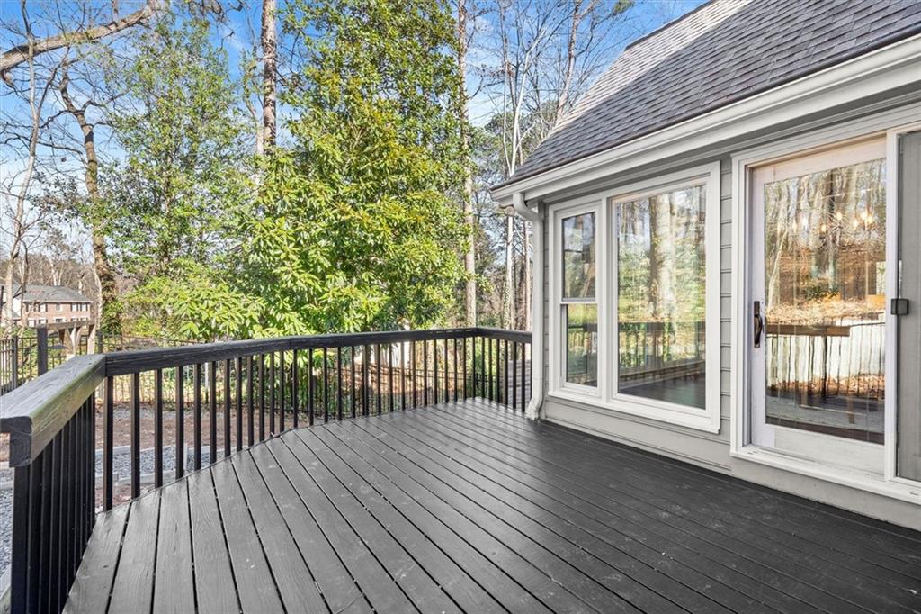 4367 Moss Ridge Court Northeast Roswell, GA 30075 - Photo 67 of 84 a view of backyard with wooden floor and iron fence