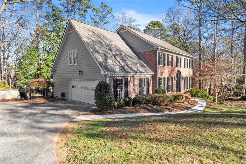 4367 Moss Ridge Court Northeast Roswell, GA 30075 - Photo 77 of 84 a view of a house with backyard and sitting area
