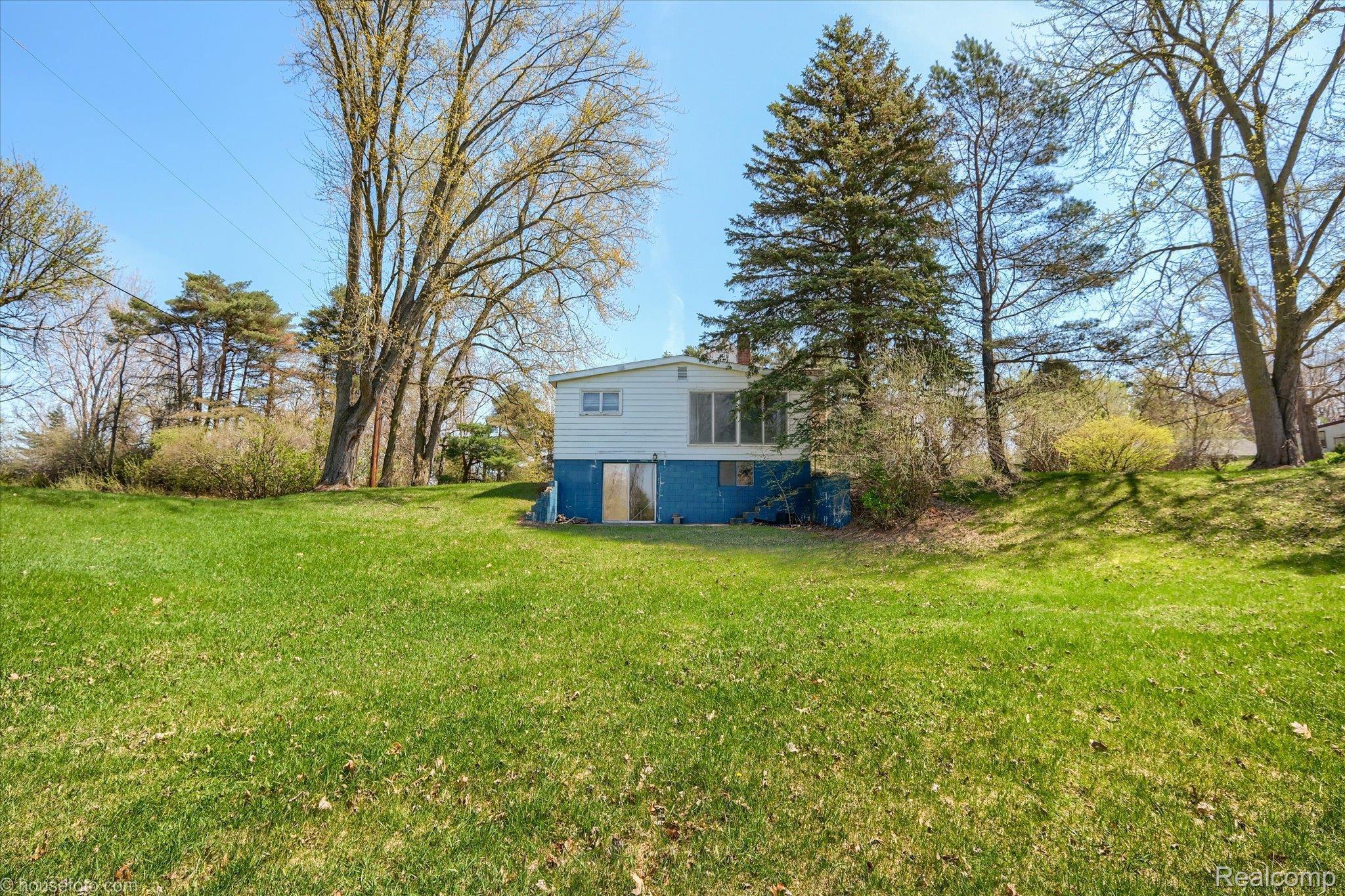 1325 Barnes Lake Road North Branch, MI 48461 - Photo 30 of 42 View of grassy yard with a sunroom