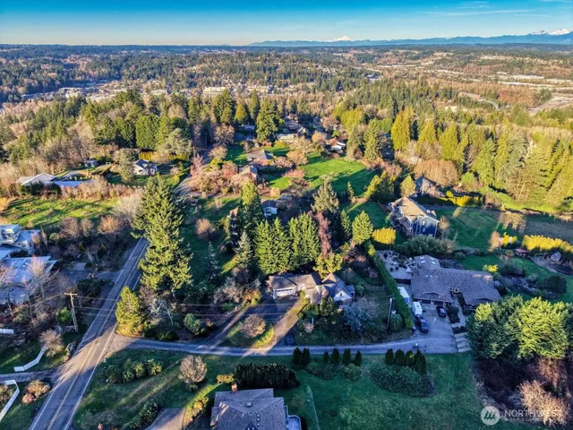 an aerial view of a house with a yard sitting area
