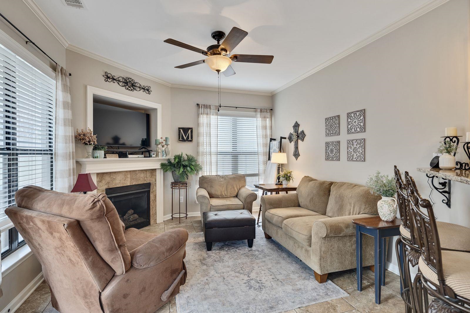 6247 Willow Walk Way Arlington, TN 38002 - Photo 13 of 40 a living room with furniture a fireplace and a flat screen tv