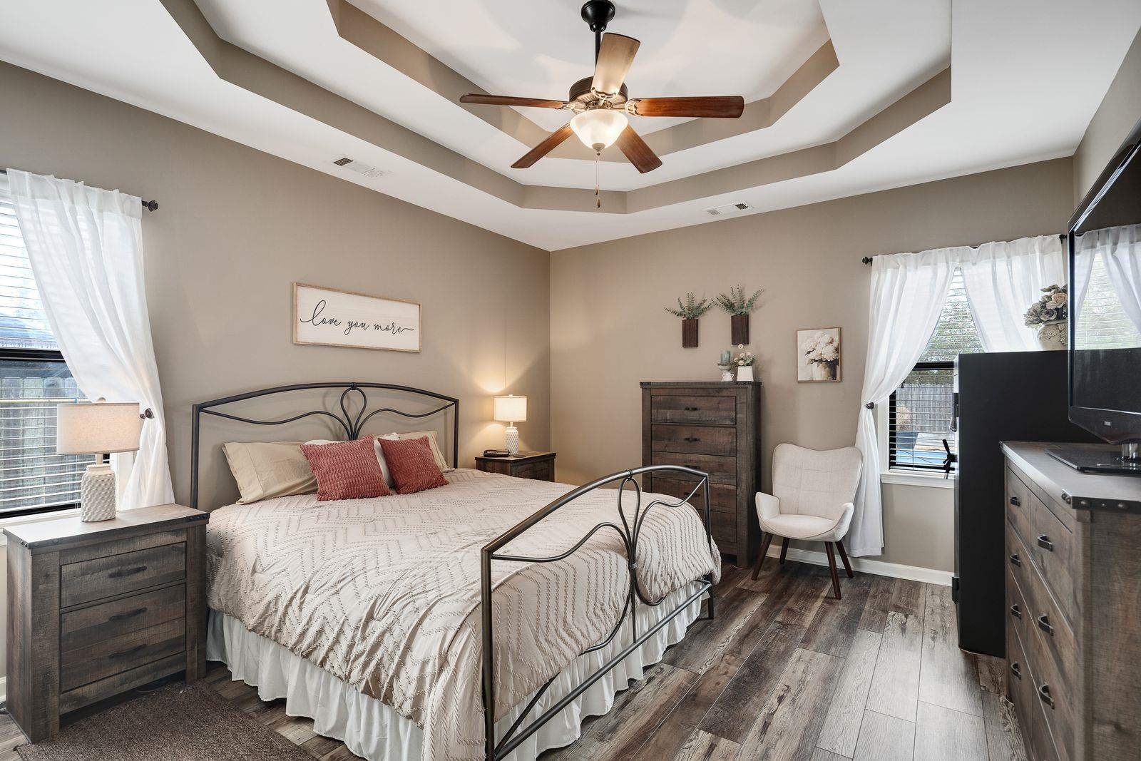 6247 Willow Walk Way Arlington, TN 38002 - Photo 19 of 40 a bedroom with a bed and a chandelier