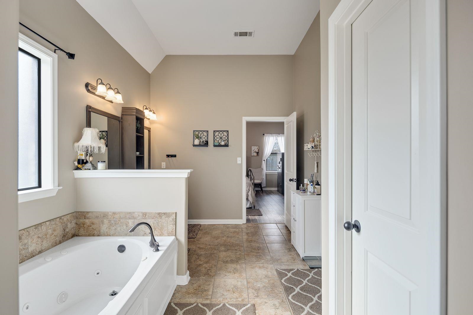 6247 Willow Walk Way Arlington, TN 38002 - Photo 20 of 40 a bathroom with a bathtub shower and a sink