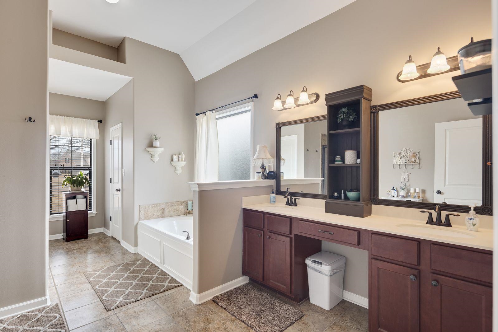 6247 Willow Walk Way Arlington, TN 38002 - Photo 22 of 40 a spacious bathroom with a double vanity sink a mirror and a shower