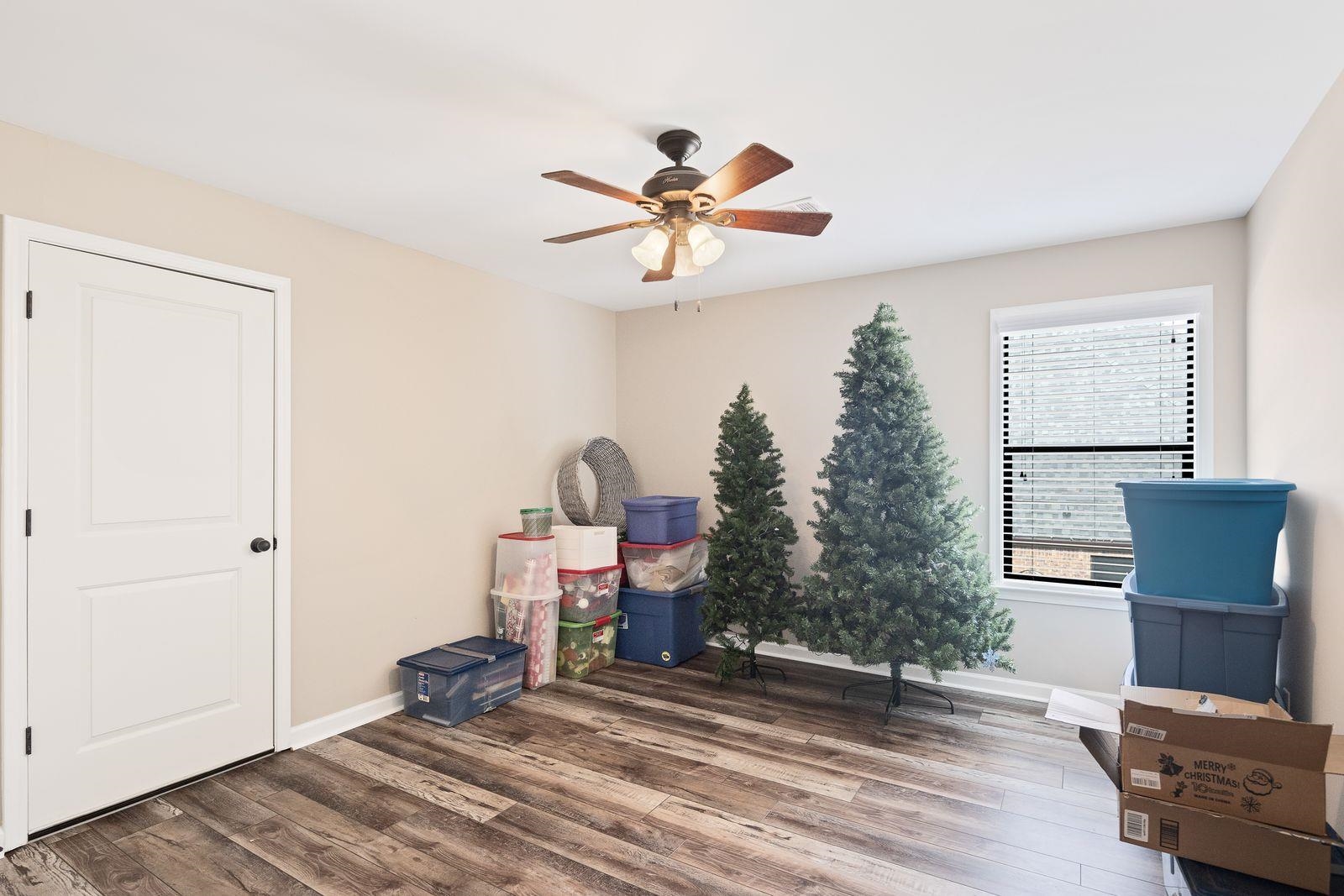 6247 Willow Walk Way Arlington, TN 38002 - Photo 28 of 40 a view of a livingroom with a chair and wooden floor