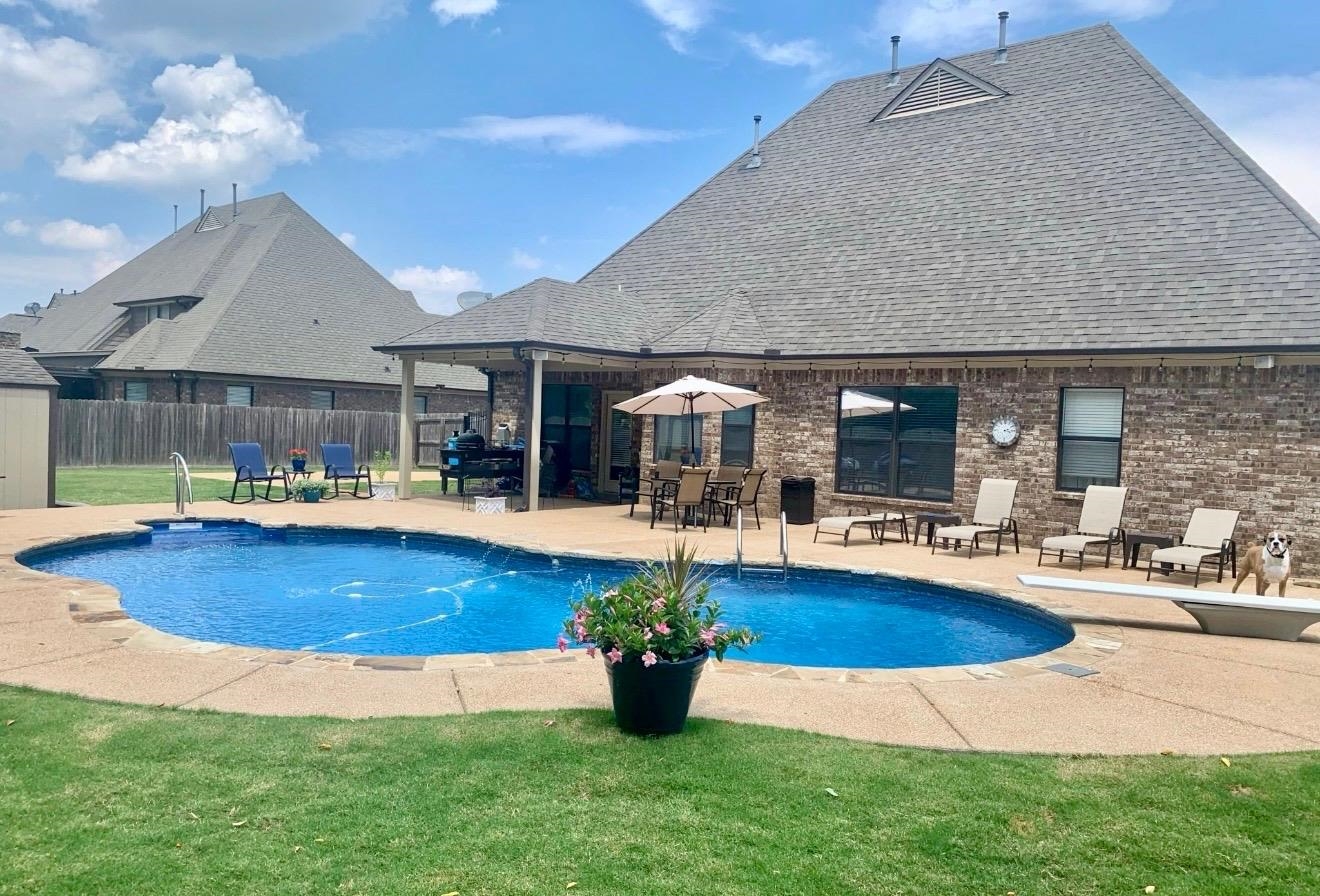 6247 Willow Walk Way Arlington, TN 38002 - Photo 37 of 40 a view of a swimming pool with lounge chairs in patio