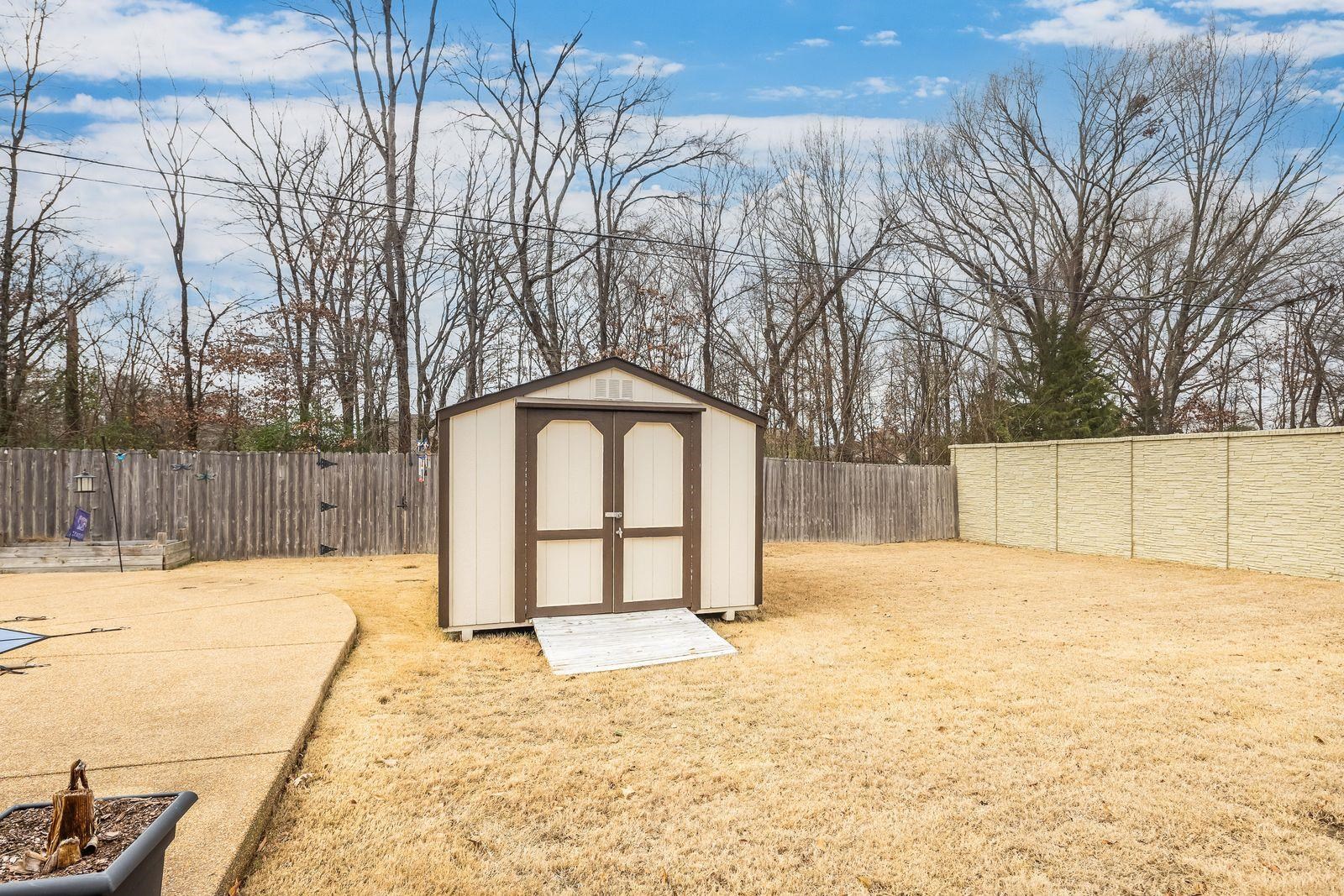 6247 Willow Walk Way Arlington, TN 38002 - Photo 39 of 40 a tall white house with trees in the background