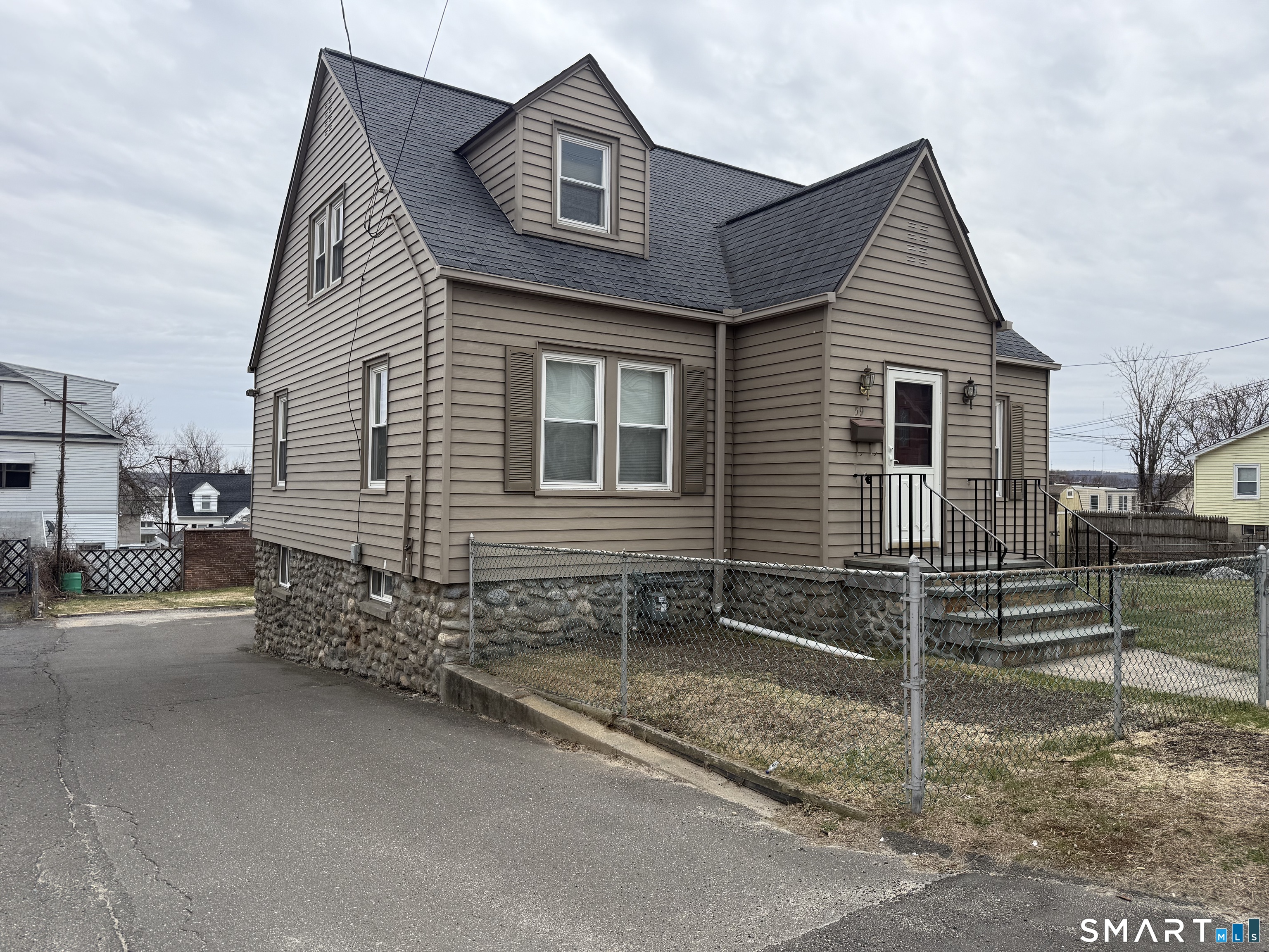 a view of a house with a yard and garage