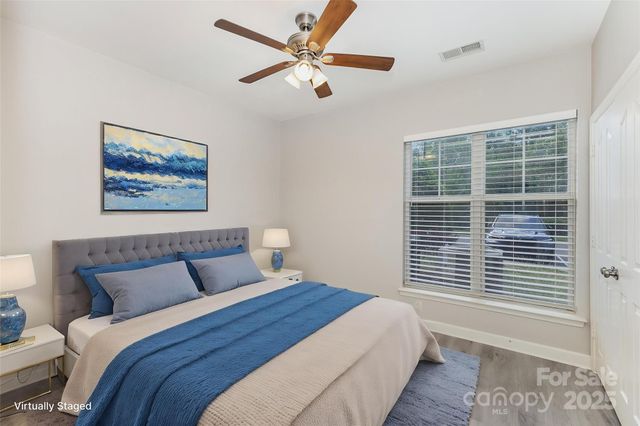 a bedroom with a large bed and a window