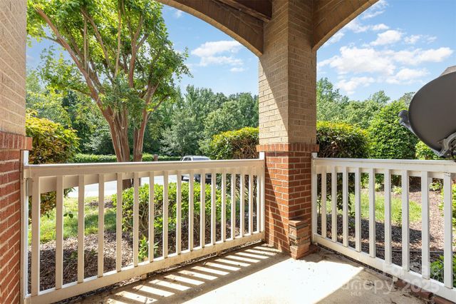a view of a two chairs in the balcony