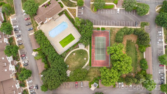an aerial view of residential house with outdoor space and swimming pool