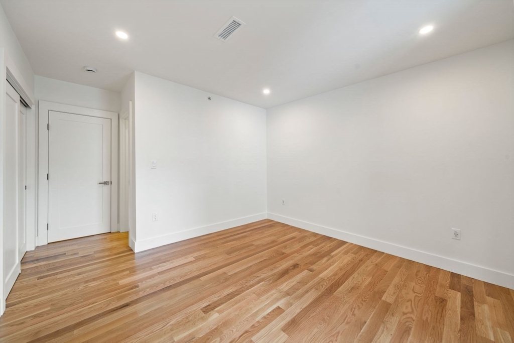6 Devine Way, Unit 2 Boston, MA 02127 - Photo 27 of 39 a view of room with wooden floor
