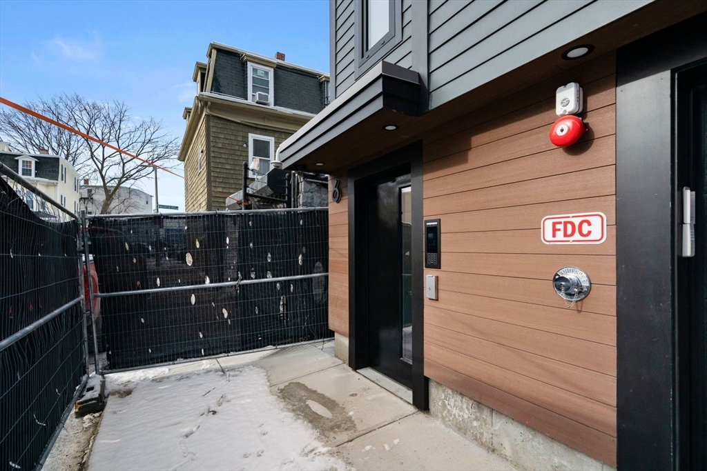 6 Devine Way, Unit 2 Boston, MA 02127 - Photo 31 of 39 a front view of a house with a yard