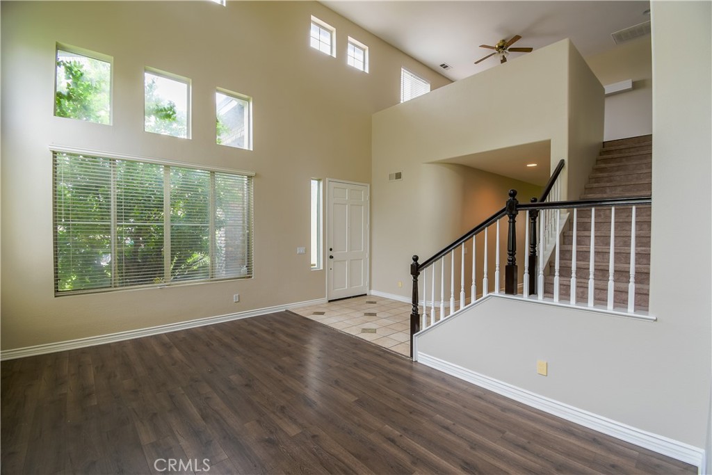 39705 Primrose Circle Murrieta, CA 92563 - Photo 3 of 31 a view of staircase with white walls and a window