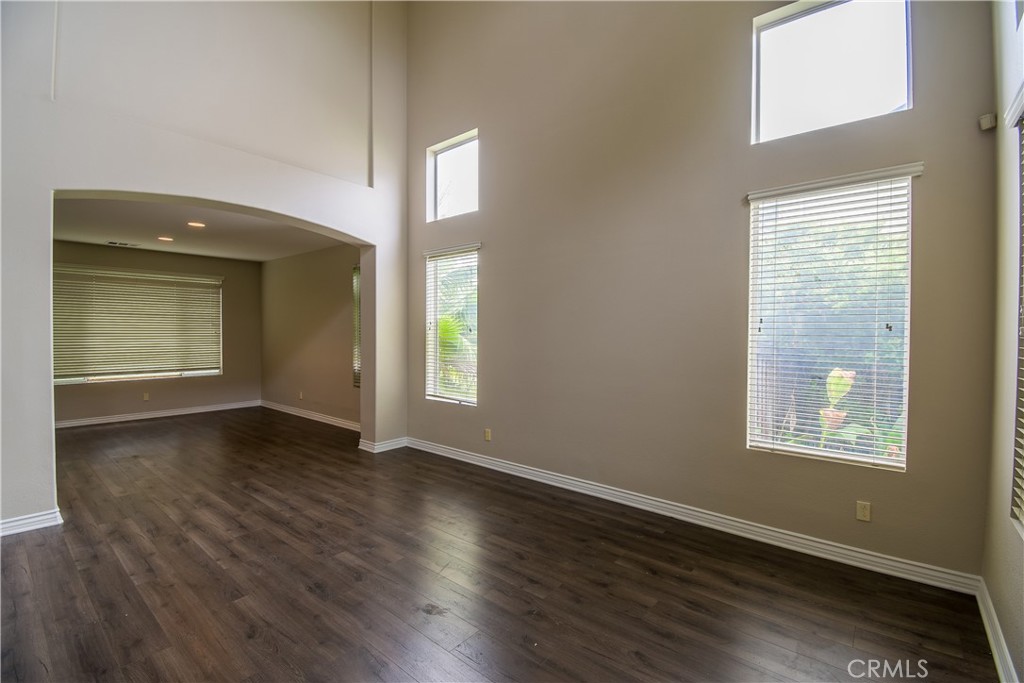 39705 Primrose Circle Murrieta, CA 92563 - Photo 4 of 31 an empty room with wooden floor and windows