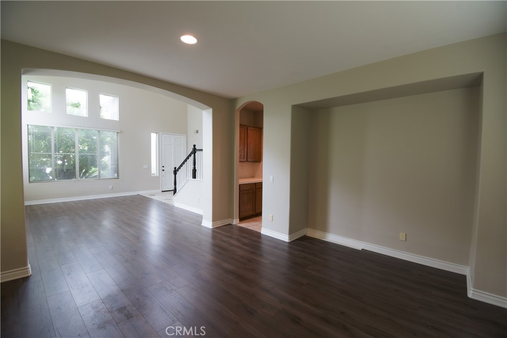 39705 Primrose Circle Murrieta, CA 92563 - Photo 6 of 31 a view of an empty room with wooden floor and a window