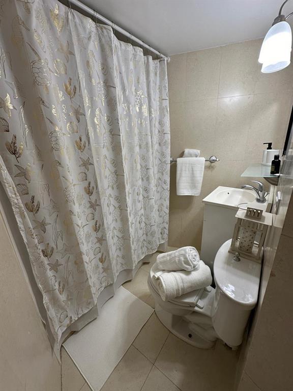 1881 Washington Avenue Miami Beach, FL 33139 - Photo 11 of 13 a bathroom with a sink toilet and shower