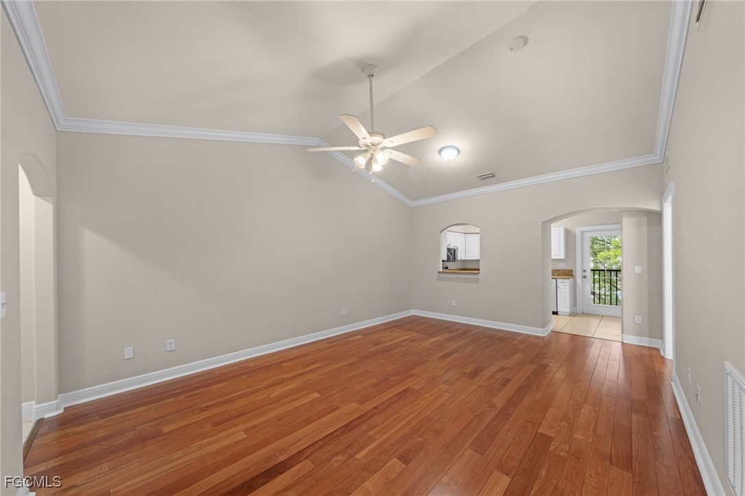 4172 Castilla Circle, Unit 201 Fort Myers, FL 33916 - Photo 3 of 34 wooden floor in an empty room with a window